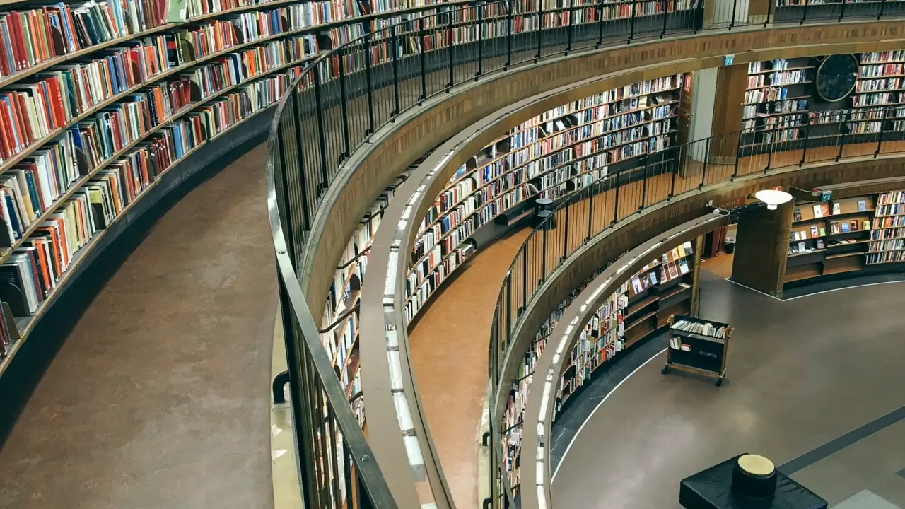 Rows of books circling the Stockholm Public Library reading room